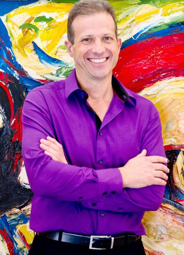 Portrait of Group CEO of the Hollard Insurance Group, Nic Kohler, smiling.