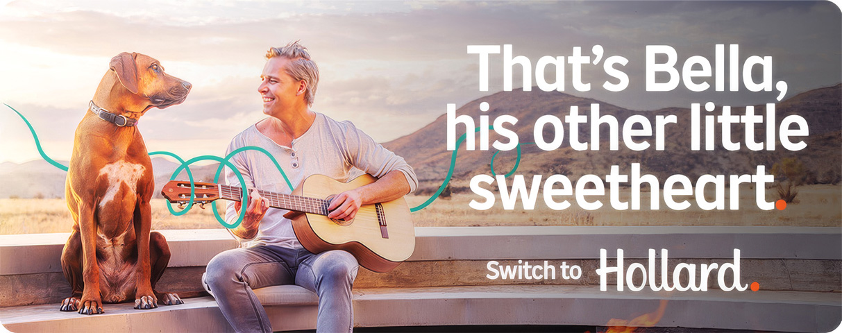 Hollard House Contents Insurance customer playing guitar next to his beloved dog